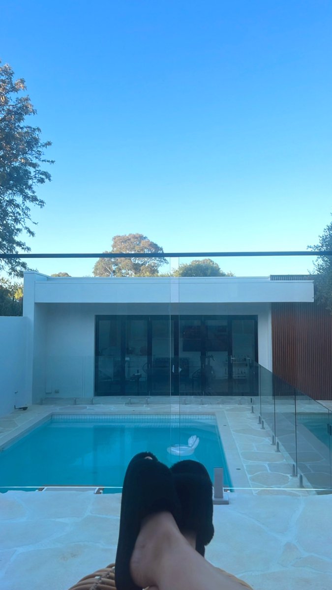 hallekila's tweet image. Lounging on my brothers deck next to the pool (while I house sit) pretending I have money lmao