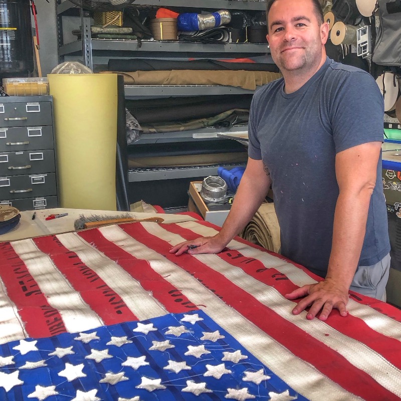 jakerecycled's tweet photo. I make these Fire Hose American Flags in my garage in Florida. 🇺🇸 Land of the free, Home of the brave. BUY ONE before I run out of fire hose......