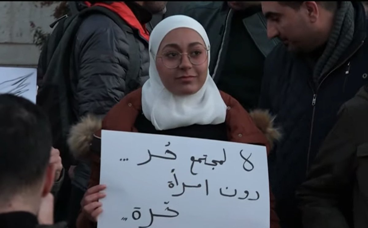 KareemRifai's tweet photo. A peaceful demonstration today of Muslims and Christians together in the heart of Damascus, calling for a secular, democratic Syria.

The woman's sign reads: "there is no free society without free women."

Under Assad, this type of assembly was banned and violently put down. https://t.co/dNWh7u4lpP