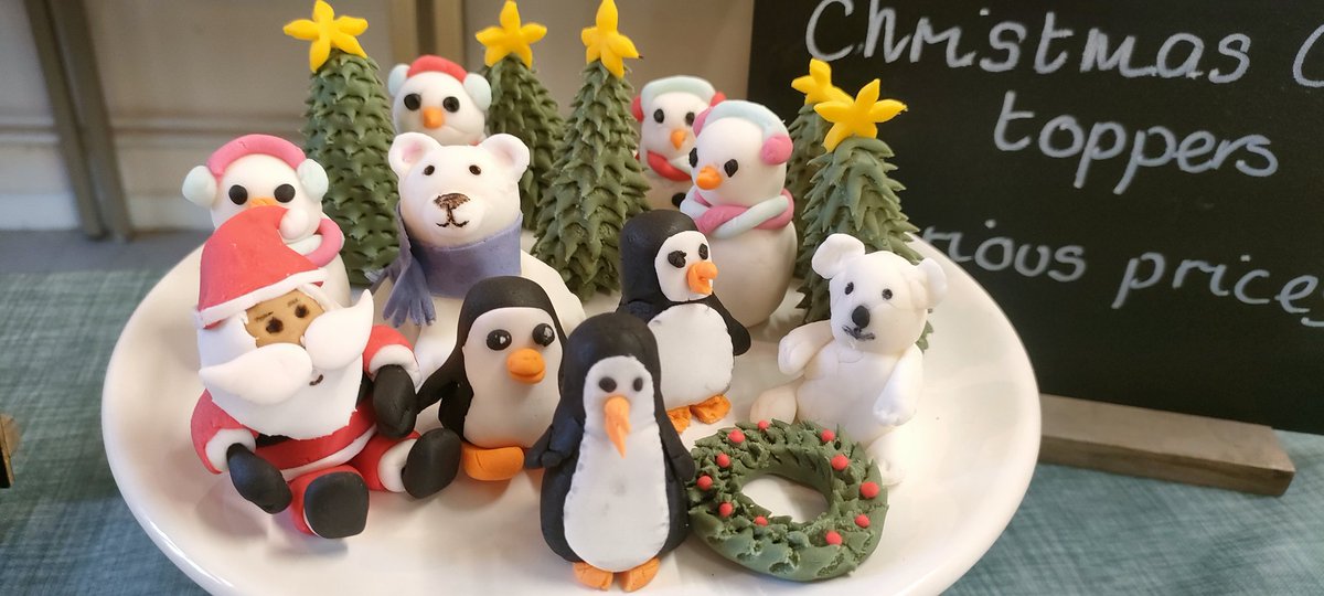 craftXandra's tweet photo. A break from the AI art for a moment, made some fondant cake toppers for Christmas. Lots of fun &amp; fiddly moments getting the moustache to stay on Santas face 😂 https://t.co/h1lMndqIXv