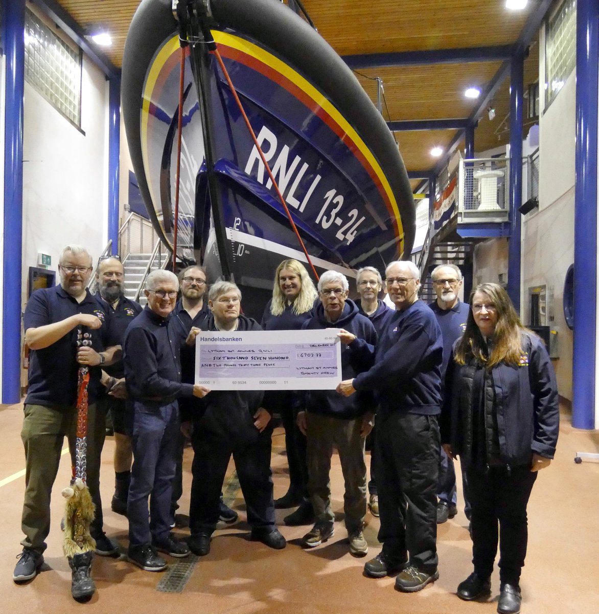 The crew were proud to present a cheque of £6700 to Chris Wrigley of Lytham St Annes RNLI at the boathouse on 16 Dec 2024, representing their 2024 solo fundraising efforts (performance &amp; CD).

Photo: David Forshaw, RNLI.