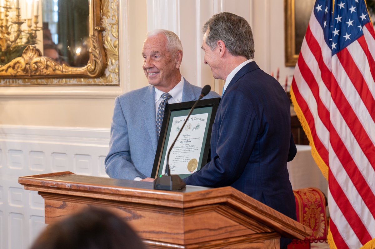 NC_Governor's tweet photo. Coach Williams exemplifies what it means to be a Tar Heel and a North Carolinian. Today, Gov. Cooper presented Coach Roy Williams with the Order of the Long Leaf Pine, the state’s highest honorary society. https://t.co/MiBNL0Cvmq