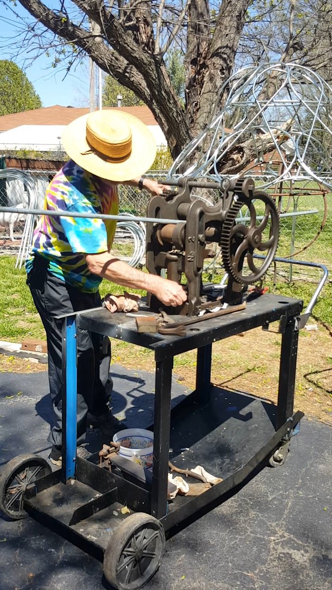 DonTupset's tweet photo. There's a lot going on here!
I'm operating an antique blacksmith's tool called a 'tire bender' while wearing a hippy shirt, an Amish hat, and packin' a cellphone on my hip.
 I'm bad! @wiseunclebuck  @terrymeiners @KYCara @johnrogersatty @RexChapman @Singingdove3 https://t.co/hwyRmGzYDb
