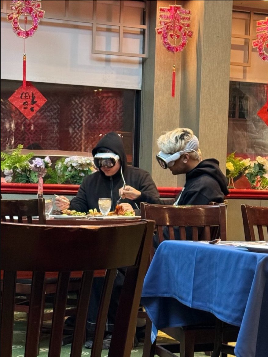 Not a cell phone in sight, just two friends, present in the moment, enjoying a meal together.