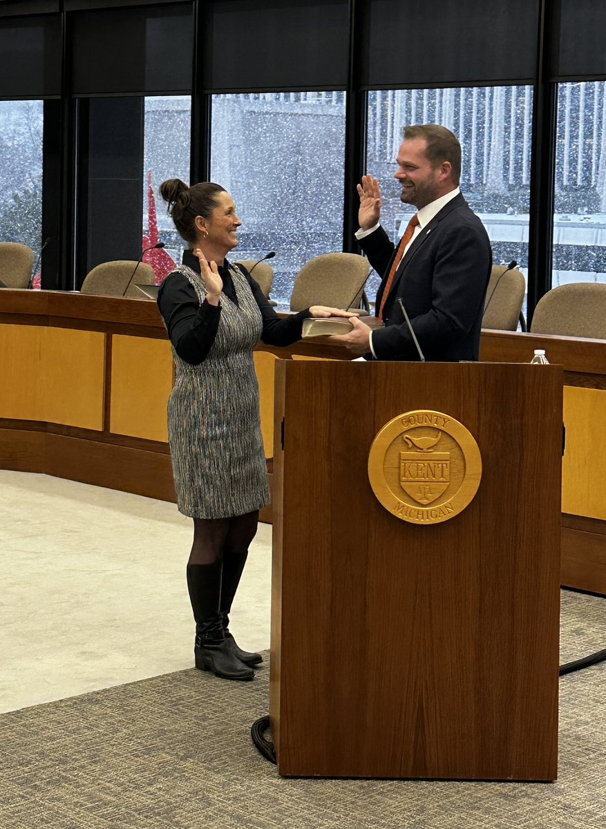 KentCountyClerk's tweet photo. This afternoon, Lisa Posthumus Lyons was sworn-in for her third term as Kent County Clerk/Register of Deeds. Administering the Oath of Office was her brother, State Rep. Bryan Posthumus. Lisa was joined by her husband, Captain Brad Lyons, and two of their four children. https://t.co/eqitE6wrN3