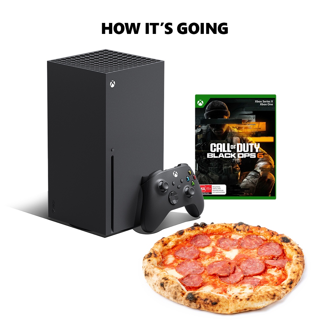 An Xbox 360, a woodfired pizza, and case art for Call Of Duty: Black Ops 6.