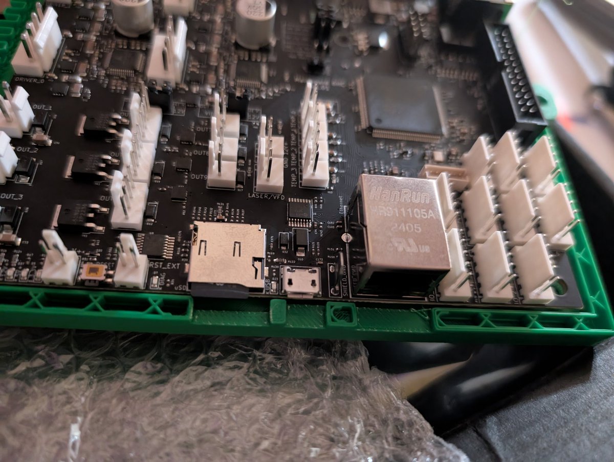 HumbleBeastKerr's tweet photo. Failed to account for the soder pins on the bottom side of the board and learned that my mark-1 (1.1 with LASIK) eyeball thought this board was square. The cutouts matched up, a quick redesign and new prints coming. Off to bed for now and let the machines work while I sleep. #ProjectOpal #Engineering