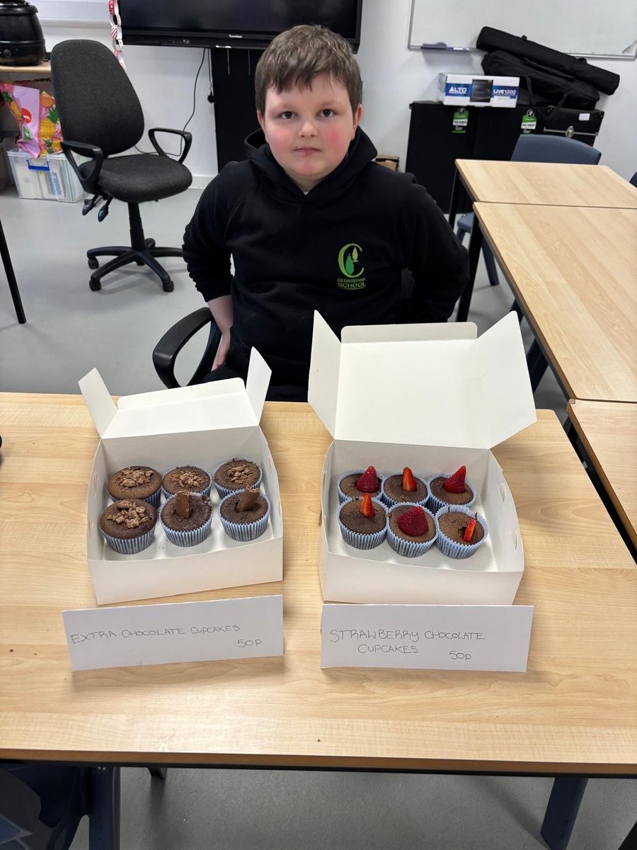 CedarbankSchool's tweet photo. This guy says 'Cedarbank is open for business!' He has taken a keen interest in enterprise. He baked cakes, advertised and sold them all this morning! #effectivecontributor #skillsforlife https://t.co/cRyZRtSD6p