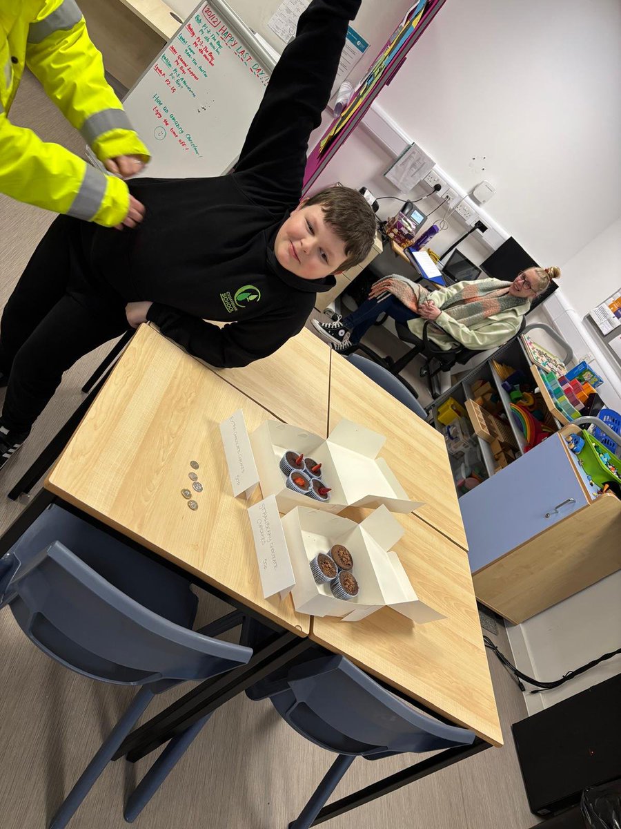 CedarbankSchool's tweet photo. This guy says 'Cedarbank is open for business!' He has taken a keen interest in enterprise. He baked cakes, advertised and sold them all this morning! #effectivecontributor #skillsforlife https://t.co/cRyZRtSD6p