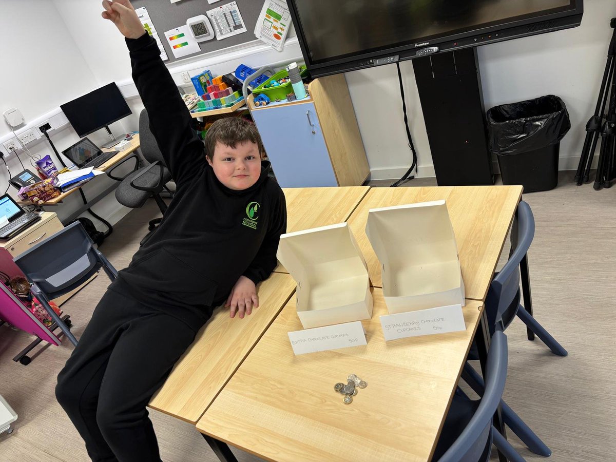 CedarbankSchool's tweet photo. This guy says 'Cedarbank is open for business!' He has taken a keen interest in enterprise. He baked cakes, advertised and sold them all this morning! #effectivecontributor #skillsforlife https://t.co/cRyZRtSD6p