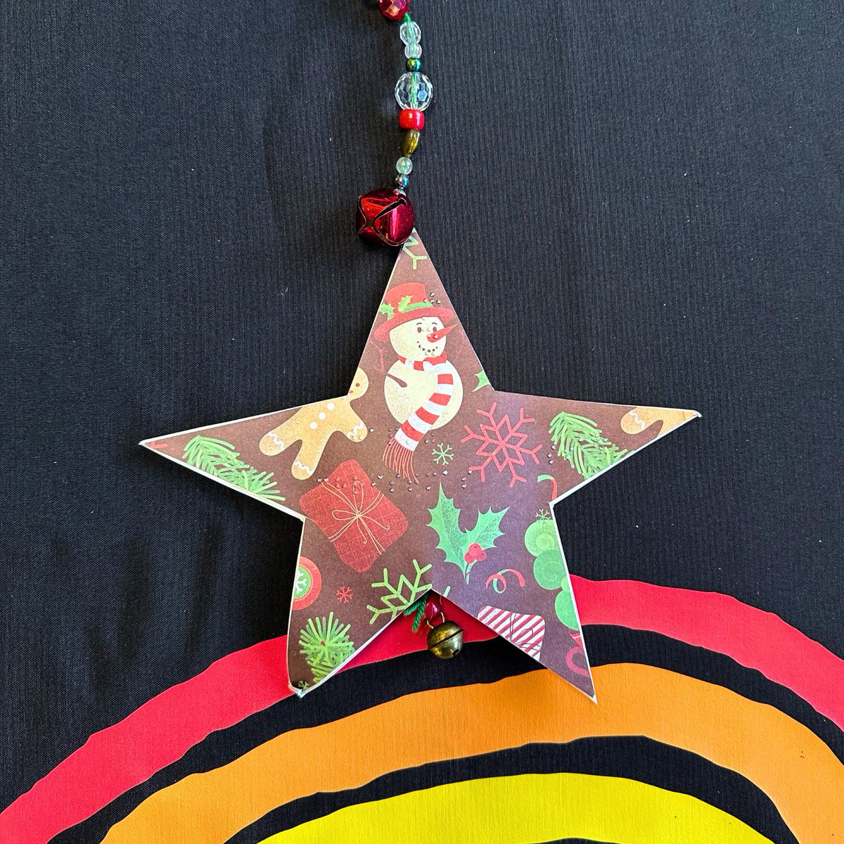 Bruce, age 9, is a creative star! He cut a star shape from Christmassy paper to make his decoration. He tells us "The star says 'Happy Christmas' in braille in the centre. It has beads to make it more tactile and bells so you can hear it twinkling." 

#TreeForTreats