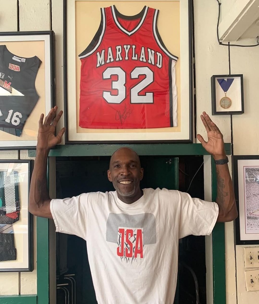 Maryland great Joe Smith posing in front of his signed jersey at Bentleys. Terps LEGEND.