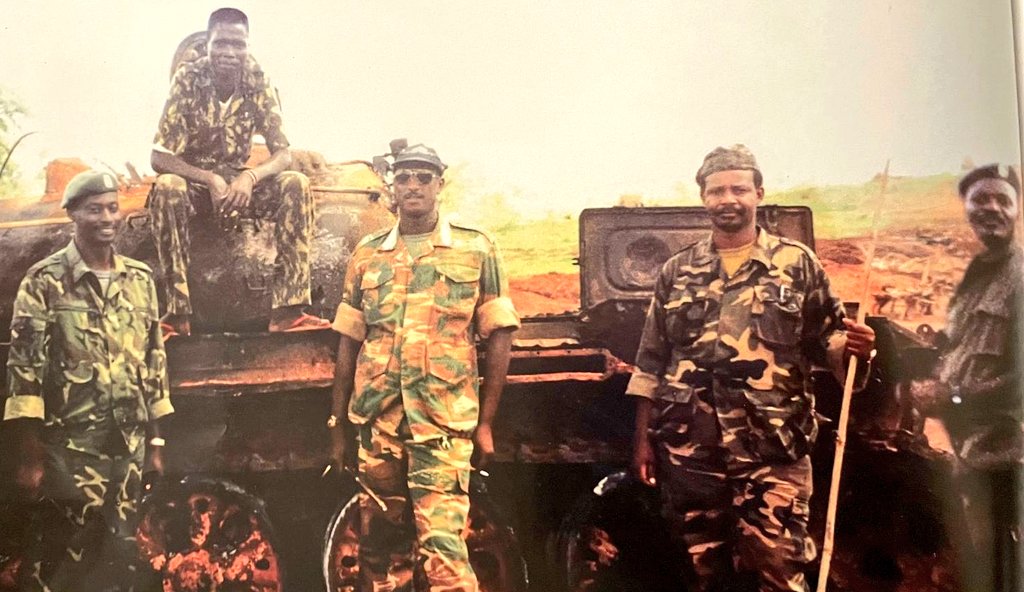 UgandaMilitary's tweet photo. 𝐅𝐨𝐮𝐫 𝐢𝐧 𝐎𝐧𝐞.
Col. Aronda Nyakarima (Gen), Maj Gen. Caleb Akandwanaho (Gen), Brig. Gen James Kazini (Maj Gen) &amp; Col. @GenWamala (Gen) &amp; an unidentified soldier (atop tank) during operations to weed out rebel elements in West Nile, Uganda &amp; Southern Sudan circa 1997. [1 https://t.co/c0xwNR8we1
