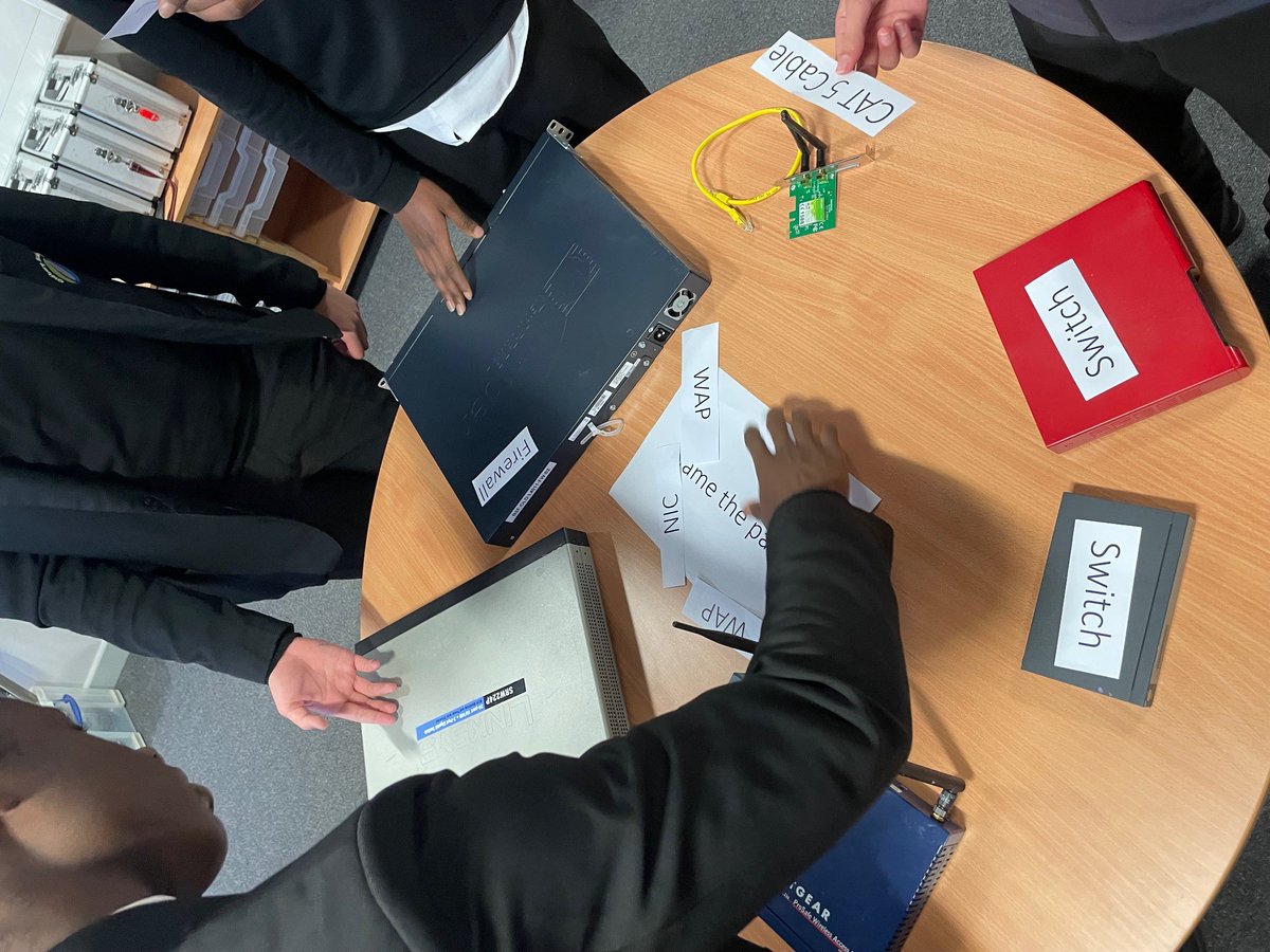 Y10 computer science students using the computer science innovation room to learn about networking in a practical way.