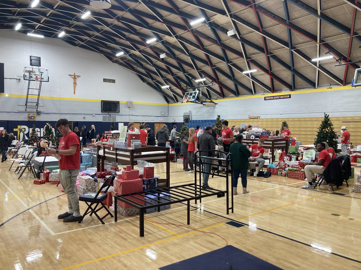 cmolewis7's tweet photo. Our Senior Class raised almost 50K worth of gifts for their Xmas Basket Project. The Regina community came together to purchase gifts for 18 impoverished families. A gym full of gifts ranging from clothes and toys to basketball hoops and beds is an amazing sight to see! https://t.co/xbbFhmdw27