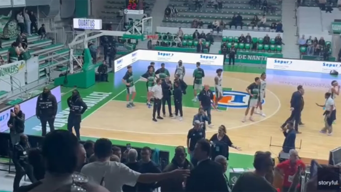 Evelyn__Knight's tweet photo. A group of agitators waving Palestinian flags stormed the court during a basketball game between Israel’s Hapoel Holon and France’s Nanterre 92, sparking chaos in the stands. 

The bedlam came during the third quarter of the game in Nanterre, France, which was part of the FIBA Basketball Champions League. 

Around 10 individuals ran onto the court waving Palestinian flags, angering hundreds of attendees from the French Jewish community cheering for the Israeli team. 

Some of the anti-Israel agitators jumped into the stands and were quickly apprehended by security. A group on the pro-Israel side began breaking out into nationalist chants. 

The match resumed a few minutes later after police detained the disruptors. Security was ramped up for the remainder of the game, including officers equipped with shields, to separate members of the Jewish community from other fans.

The Ministry of Diaspora Affairs had issued a warning regarding the game earlier in the day, including initial indications of a planned protest by groups expected to gather near the arena. These included the pro-Palestinian organization Europalestine and the far-left party La France Insoumise. 

Nanterre Mayor Raphaël Adam earlier this week barred fans from attending the game to "prevent public disturbances," but a court overturned that decision Wednesday morning.

Hapoel Holon lost the game to Nanterre, 87-77. But the Israeli team still advanced to the Top 16 stage thanks to the loss of Bosnian team Igokea to German team Würzburg. Yotam Hanochi led Guy Goodes’ scorers with 18 points, while Paul Lacombe excelled on the opposing side with 23 points.‘
A group of agitators waving Palestinian flags stormed the court during a basketball game between Israel’s Hapoel Holon and France’s Nanterre 92, sparking chaos in the stands.

The bedlam came during the third quarter of the game in Nanterre, France, which was part of the FIBA Basketball Champions League.

Around 10 individuals ran onto the court waving Palestinian flags, angering hundreds of attendees from the French Jewish community cheering for the Israeli team.

Some of the anti-Israel agitators jumped into the stands and were quickly apprehended by security. A group on the pro-Israel side began breaking out into nationalist chants.

The match resumed a few minutes later after police detained the disruptors. Security was ramped up for the remainder of the game, including officers equipped with shields, to separate members of the Jewish community from other fans.

The Ministry of Diaspora Affairs had issued a warning regarding the game earlier in the day, including initial indications of a planned protest by groups expected to gather near the arena. These included the pro-Palestinian organization Europalestine and the far-left party La France Insoumise.

Nanterre Mayor Raphaël Adam earlier this week barred fans from attending the game to "prevent public disturbances," but a court overturned that decision Wednesday morning.

Hapoel Holon lost the game to Nanterre, 87-77. But the Israeli team still advanced to the Top 16 stage thanks to the loss of Bosnian team Igokea to German team Würzburg. Yotam Hanochi led Guy Goodes’ scorers with 18 points, while Paul Lacombe excelled on the opposing side with 23 points.‘
#FIBAChampionsLeague
#Israel
#France