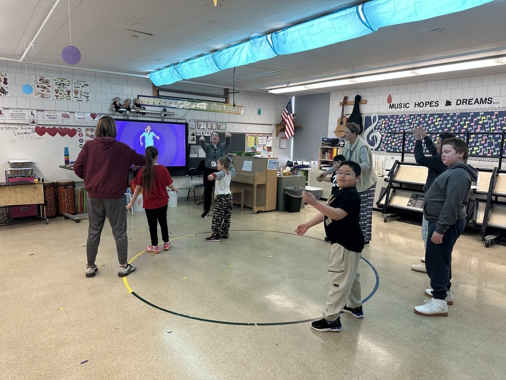 Frost Fest is in full swing, and the students are having a great time exploring the various stations—from jump ropes to ice climbing, to enjoying hot cocoa and candy canes. It's a fun-filled day for all!