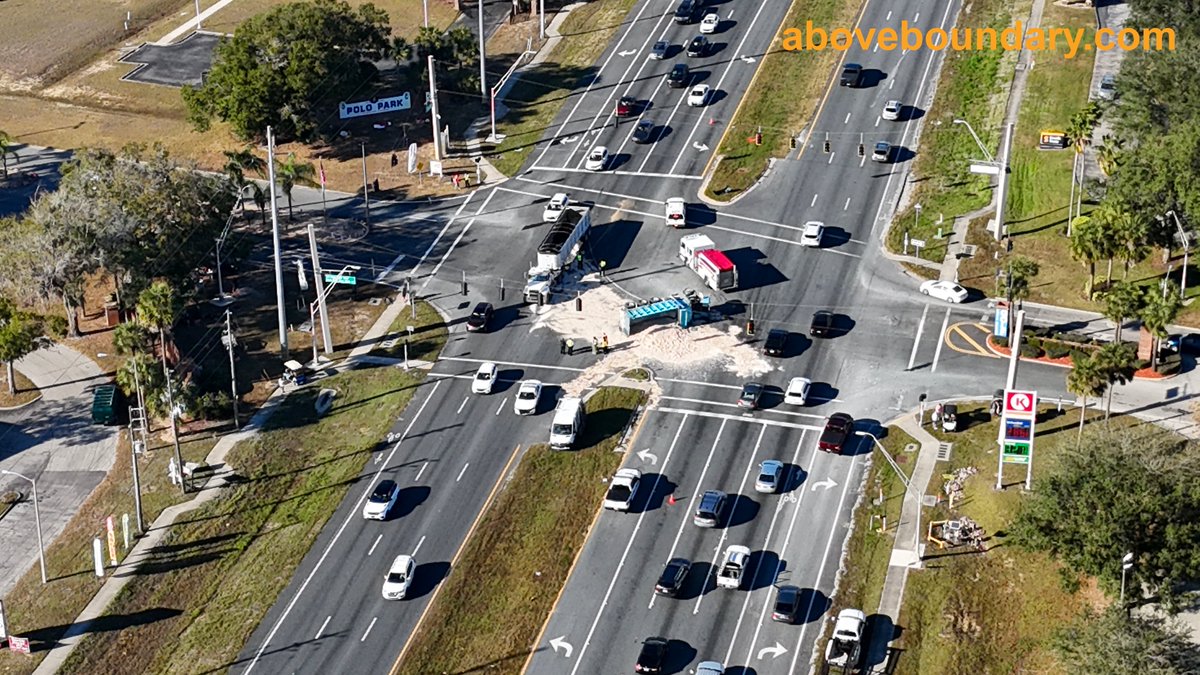 AboveBoundary's tweet photo. Captured the aftermath of a dump truck accident at the intersection of US 27 and Polo Park East Blvd in Four Corners, FL. The truck tipped over, spilling dirt across the highway and causing significant traffic delays.  #AerialPhotography  #FourCornersFL https://t.co/ZK1ek7UcqN
