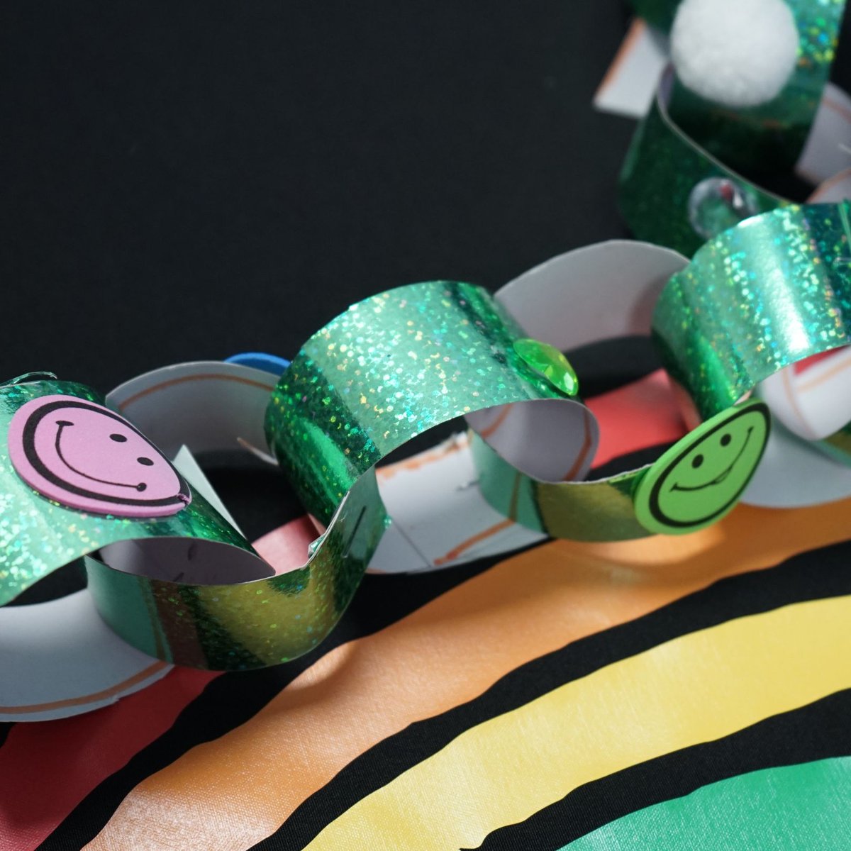 These magical decorations were made by Dexter (9) and Ethan (4)! Dexter "decorated a wooden Christmas bauble with lots of tactile gems. I like the gems as they feel nice and sparkle in the light.” Ethan made a wonderful paperchain decorated with smiley faces. #TreeForTreats