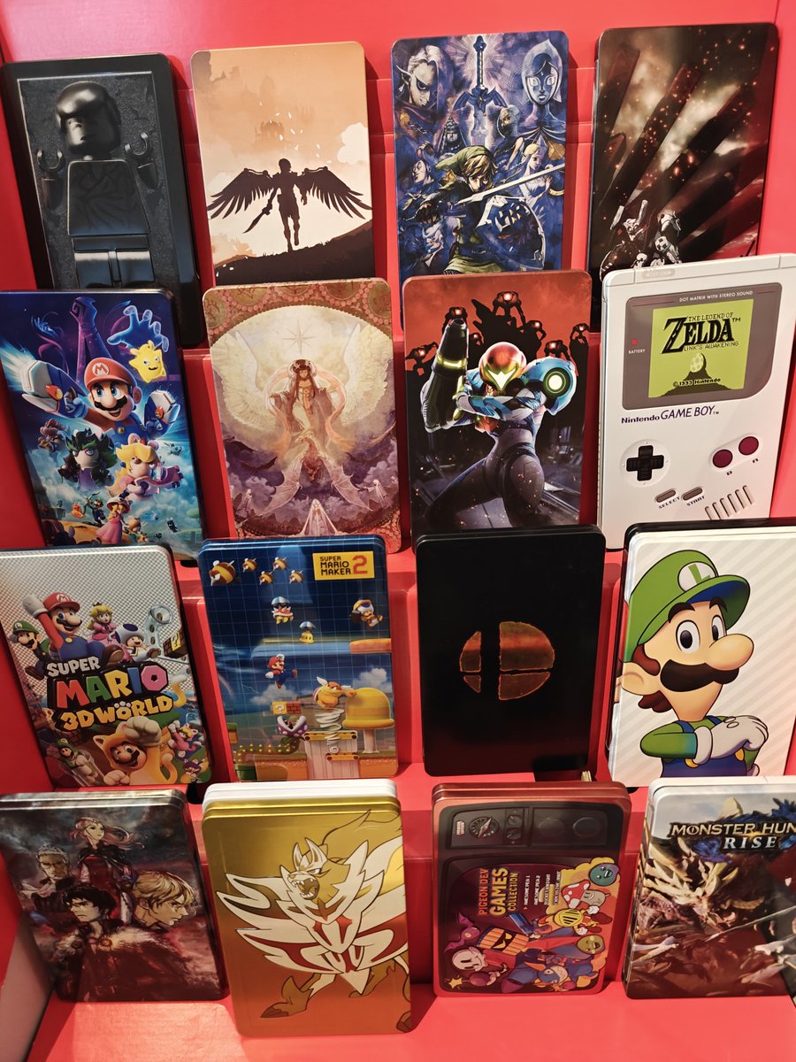 PacboySlim's tweet photo. And the right shelves are done (with Switch games M-Z). Dedicated one shelf for collectables. The display stand is emptied (for now filled with steelbooks). The collection is tidy again, now it's time to play! https://t.co/UGgdKxOkKh