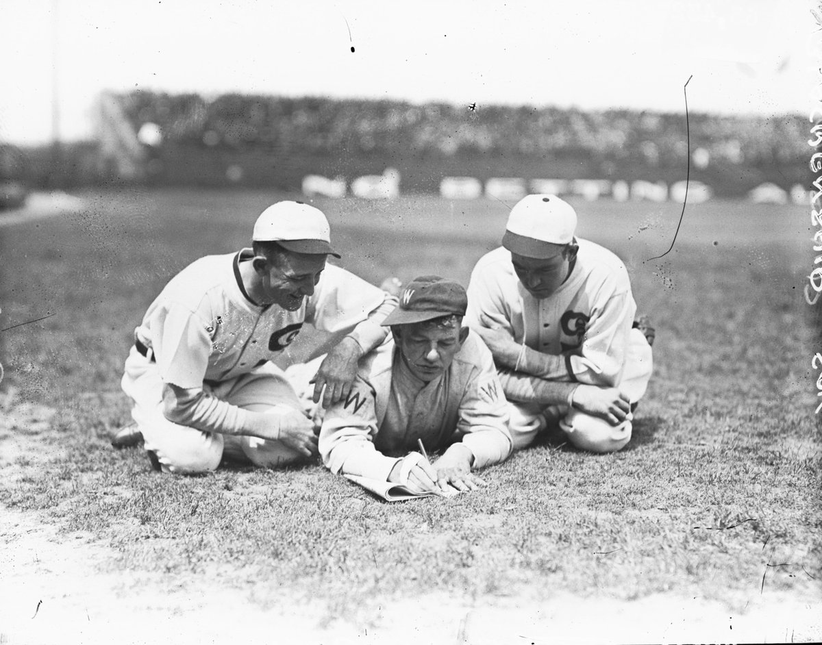 #OnThisDay in 1913, the first crossword puzzle was published. 12 years later, Nick Altrock of the Washington Senators was photographed doing a crossword puzzle in Comiskey Park with the help of two <a href="/whitesox/">Chicago White Sox</a> players. Crosswords or baseball, which is the real national pastime?