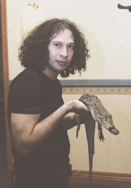 this genre of pictures where they r holding obscure ass animals