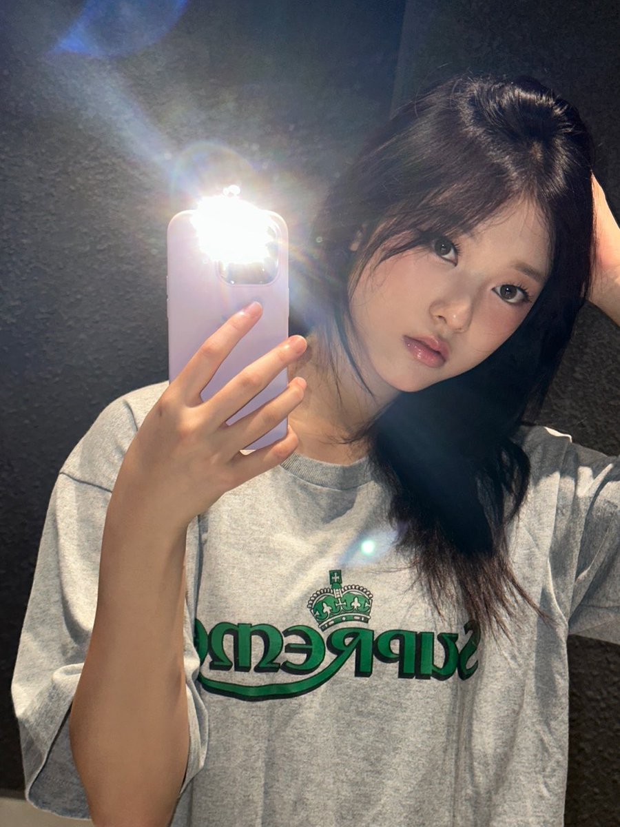 yoonseeus's tweet photo. It’s just me, a mirror, and whatever this vibe is. Something about these dim, textured walls and the camera flash turns a simple room into a whole aesthetic. Not planned, but somehow... feels like a moody album cover. And yes, the wink was 100% necessary. https://t.co/B9JlfPlLZw