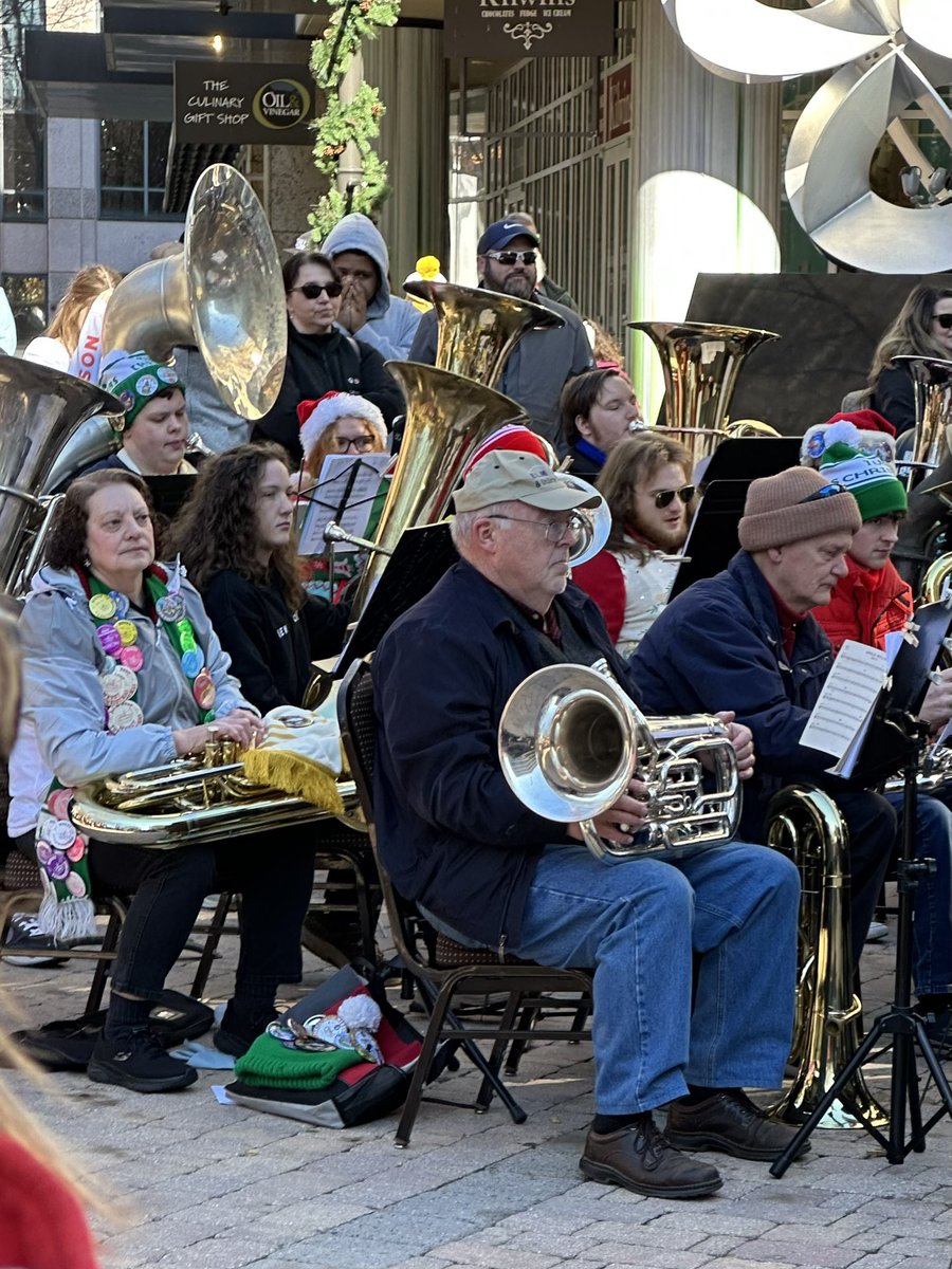 FurmanNews's tweet photo. Christmas hit all the low notes today at the #tubachristmas concert in downtown @CityGreenville. Dr Mark Britt, music prof @FurmanU, led 81 tuba, euphonium & sousaphone players, including many @Furman_Alumni in some deeply moving music. #yeahthatgreenville https://t.co/CfLD4IUtnO
