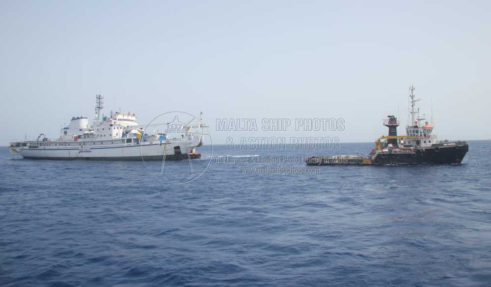 Shipguru's tweet photo. #SingaporeBuilt #offshoretug #SEA_PATRON #towing the #deadship #cablelayer #CERTA #leaving #grandharbourmalta - 08.07.2014 - https://t.co/nfgboxcB5B - NO PHOTOS can be used or manipulated without our permission @TUGSPOTTERS @worldshipsoc @Rich_Ships @ShipsInPics @ShippingMag https://t.co/VQ67LvjiM8