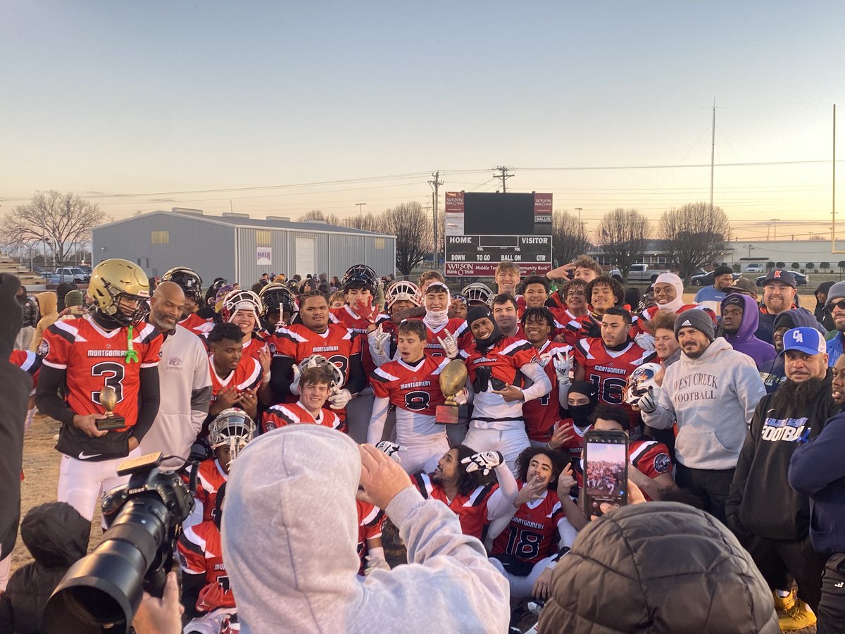 The Montgomery County All Stars celebrate with their trophy.