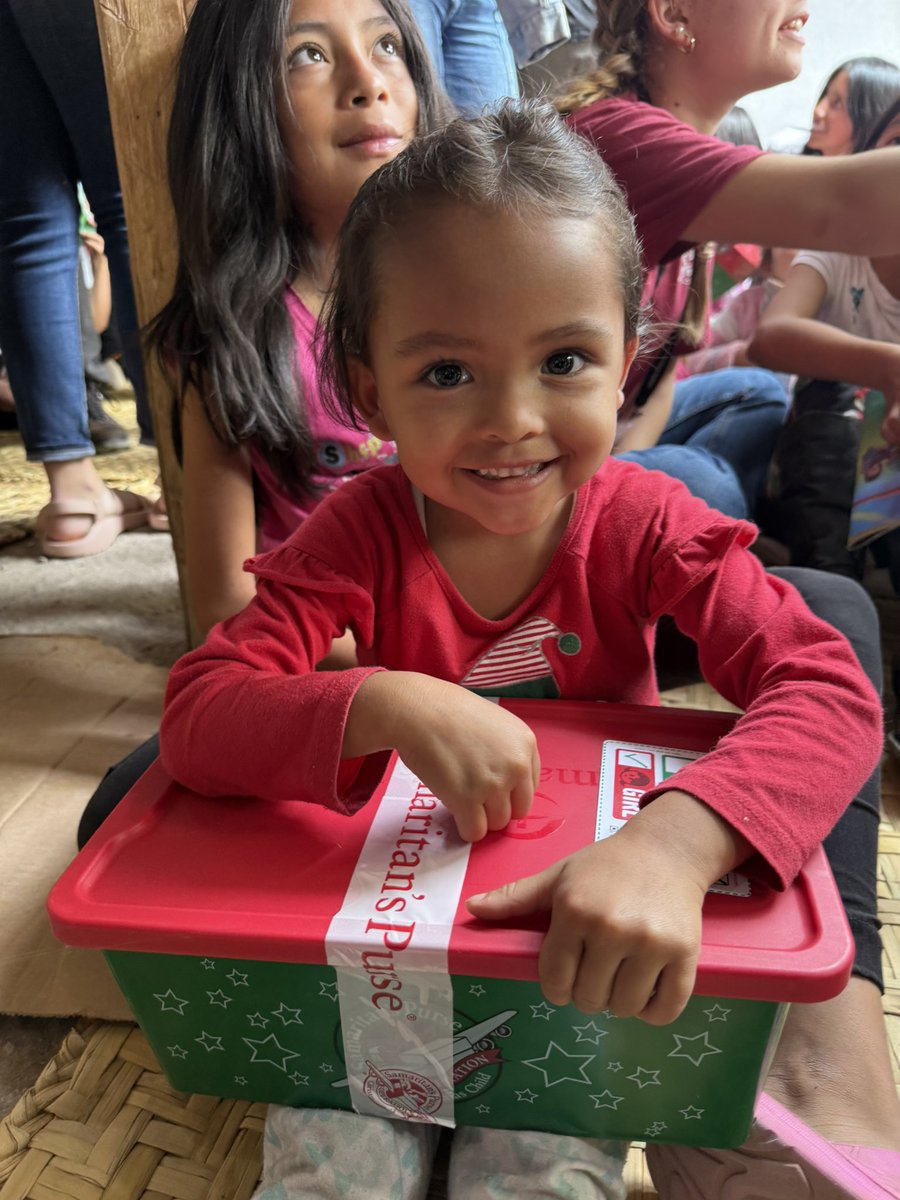A child in Ecuador getting a shoebox present packed by volunteers in USA as part of Operation Christmas Child (part of <a href="/SamaritansPurse/">Samaritan's Purse</a> )