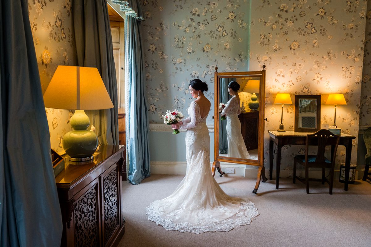 That mirror reflecting Clare was not accidental, sometimes those perfect shots have to be fine tuned!  #AuthenticLoveMoments #TimelessWeddingMemories #WeddingPhotographyInspiration #UniqueWeddingPerspectives