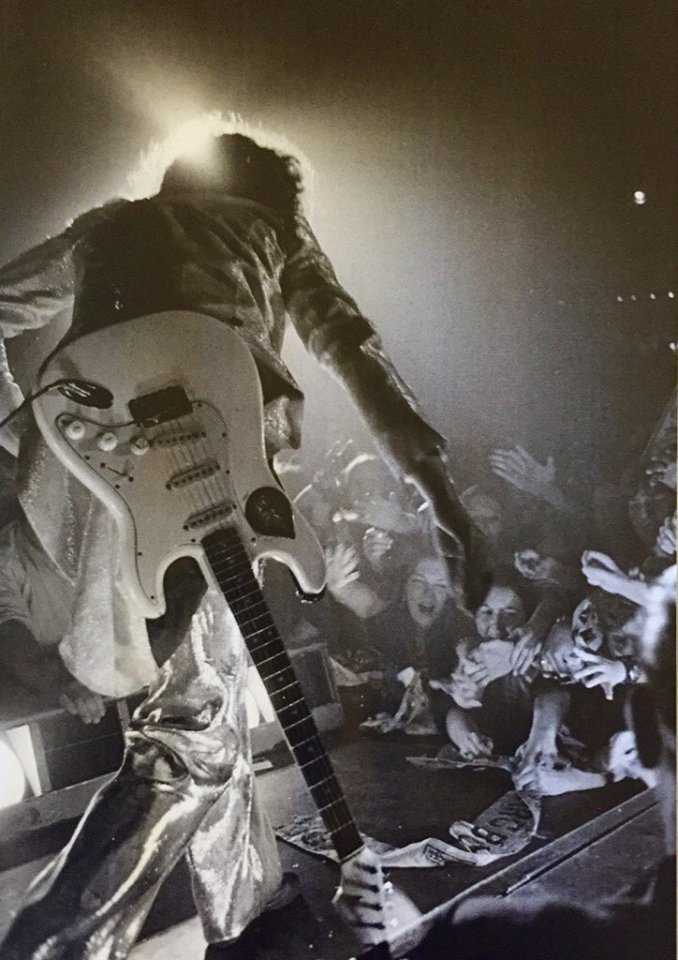 MARC BOLAN ~ T. Rex
1972 Dec. 22nd   Sundown, Edmonton
52 yrs ago, Alan Messer captured Marc in this stunning shot, 
taken at T. Rex's special Christmas gig.
Marc reaching out to his fans says it all.
The joy &amp; love between Marc and his fans was very real.
#marcbolan #TRexmas🎄
