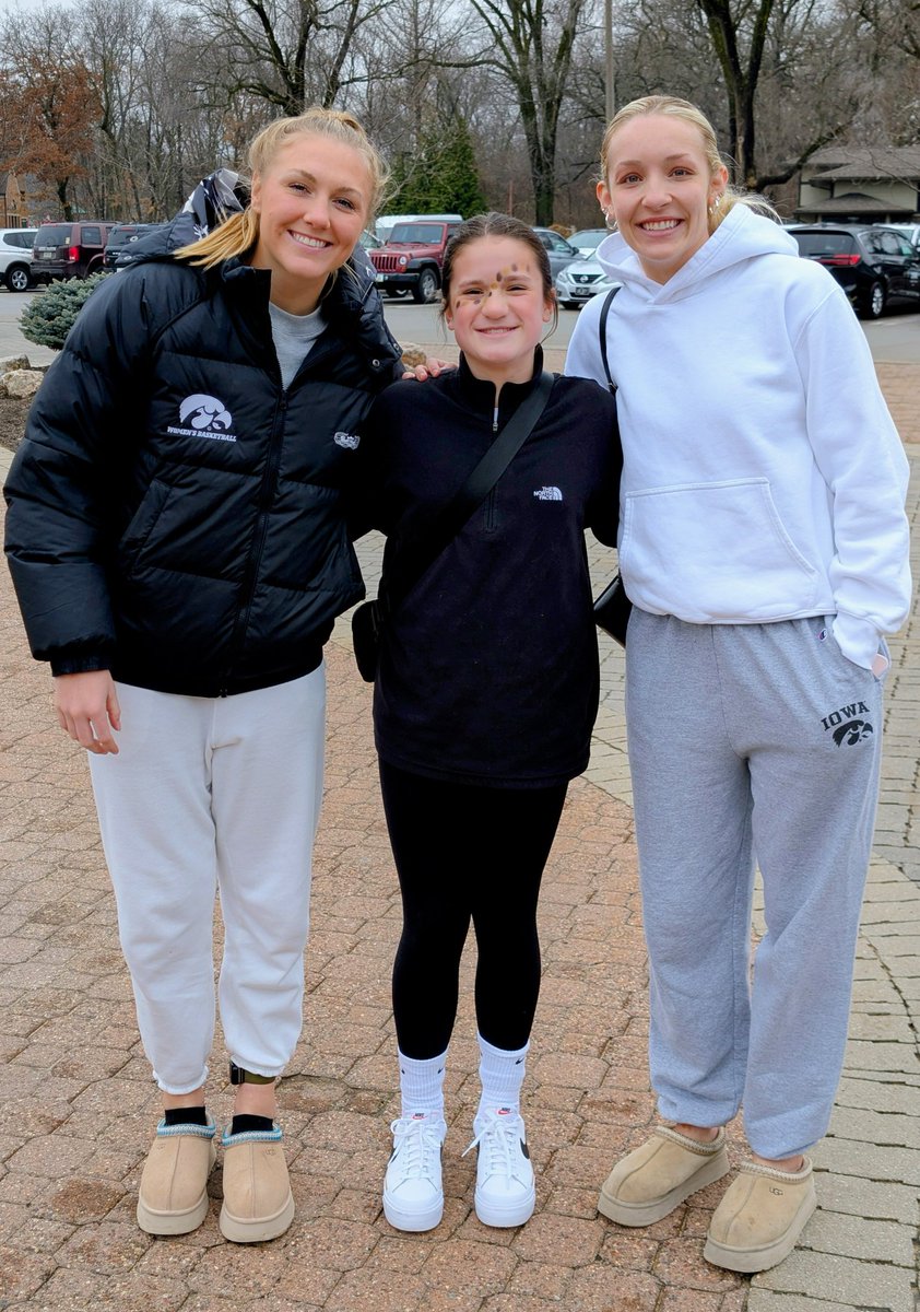 Sydney Affolter and Kylie Feuerbach taking a quick pregame photo with Brecklyn at the Purdue game today! Go Hawks! #fightforiowa