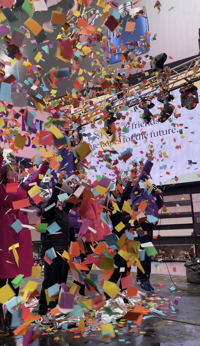 TimesSquareNYC's tweet photo. Walking in a confetti wonderland 💜☁️💛 Today’s Confetti Test with Planet Fitness was a SUCCESS! We’re getting ready to start the new year STRONG! 💪We can’t wait to watch the official #NYE confetti (along with your wishes!) float down over Times Square on #NewYearsEve 🪩 https://t.co/Hu0rN52ODX