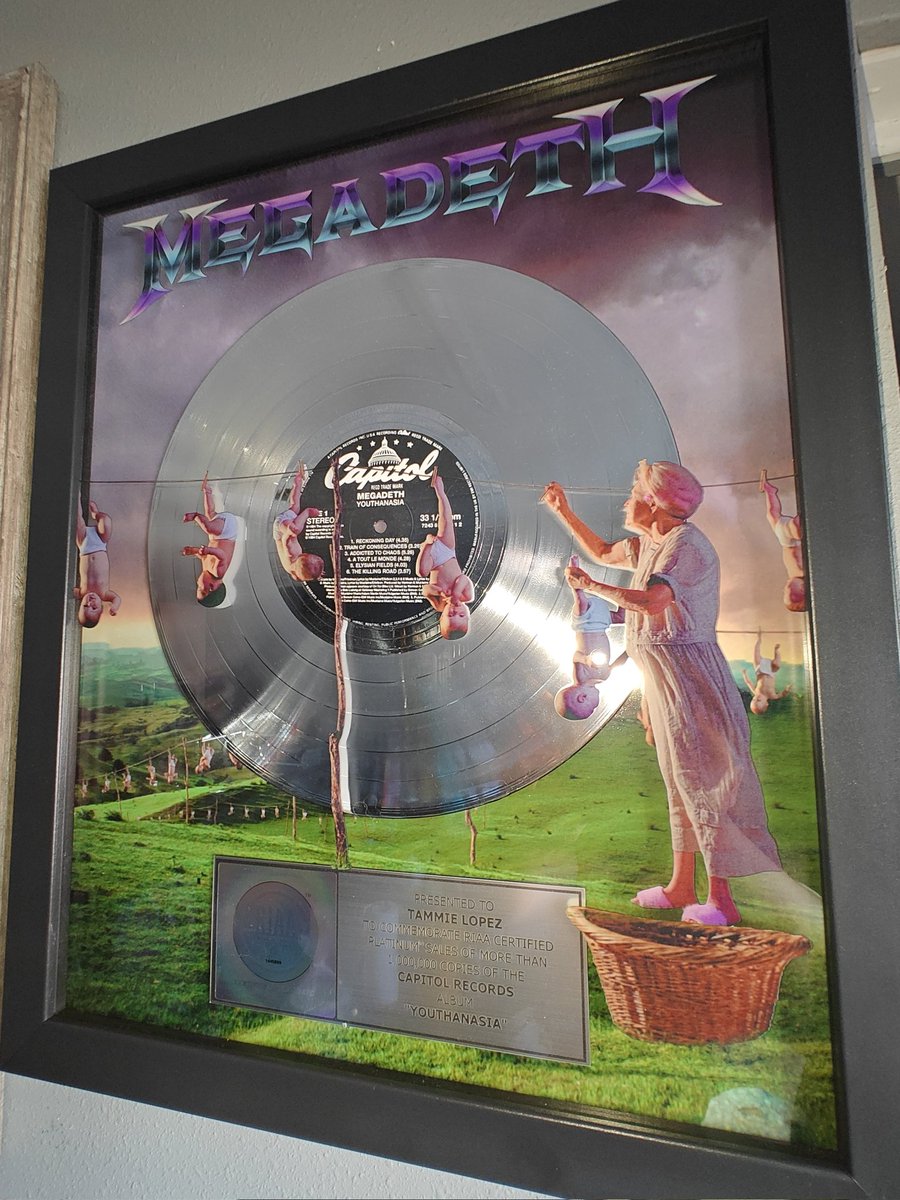 Spitfire_S2's tweet photo. Here it is! 🥹 The @Megadeth plaque I won back in November 🤘🏼 @Joe_L_Mtz found a space for it on our busy walls &amp; hung it up for me :) Sorry it took so long to see a post about it! Honored to be part of such an amazing community! 🖤 Thank you again! @MegadethDigital @DaveMustaine https://t.co/kWFLyYzOeM