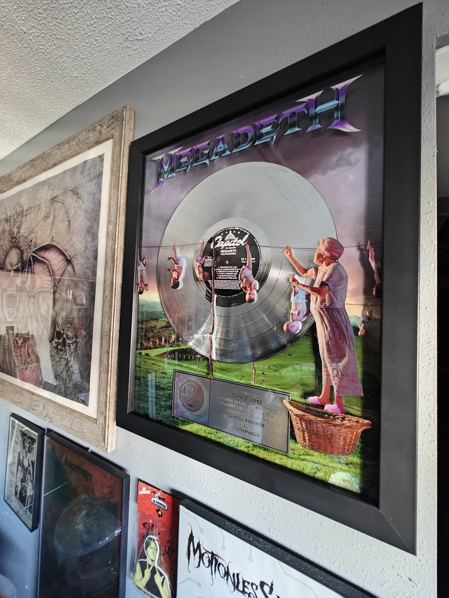 Spitfire_S2's tweet photo. Here it is! 🥹 The @Megadeth plaque I won back in November 🤘🏼 @Joe_L_Mtz found a space for it on our busy walls &amp; hung it up for me :) Sorry it took so long to see a post about it! Honored to be part of such an amazing community! 🖤 Thank you again! @MegadethDigital @DaveMustaine https://t.co/kWFLyYzOeM