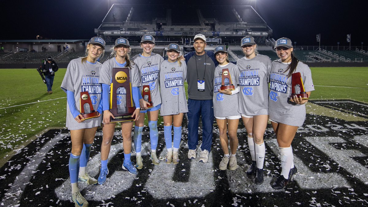 uncwomenssoccer's tweet photo. It takes a village to raise a banner 🏆 

To all of our support staff, pictured here or not, 𝓉𝒽𝒶𝓃𝓀 𝓎𝑜𝓊 – we couldn't have done it without you. https://t.co/fwYfjdCiAP