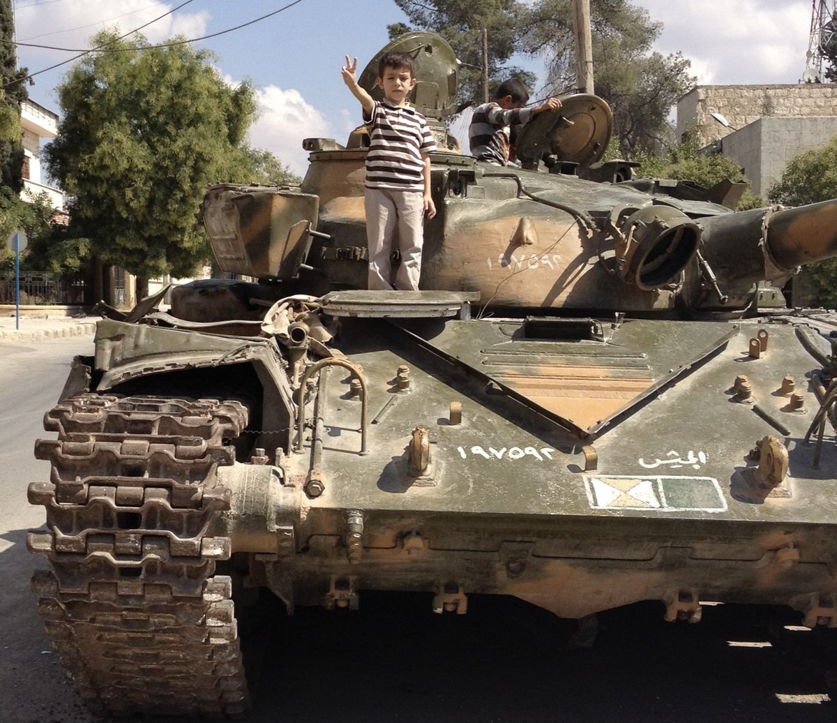 ولدي أسامة في مدينة أعزاز، التي كانت مقبرةَ دباباتِ النظام المجرم، وذلك بعدَ تحريرها بنحو أسبوعينِ عام َ2012م، ثم أكرمنا الله وعشنا فرحةَ سقوطِ نظام الأسد إلى الأبد ...
هنيئًا لكل مَن كان له يدٌ في حرب النظام وإسقاطه، فذلك بابُ خيرٍ وجهادٍ فُتِح على أرض الشام ثم أُغلق !