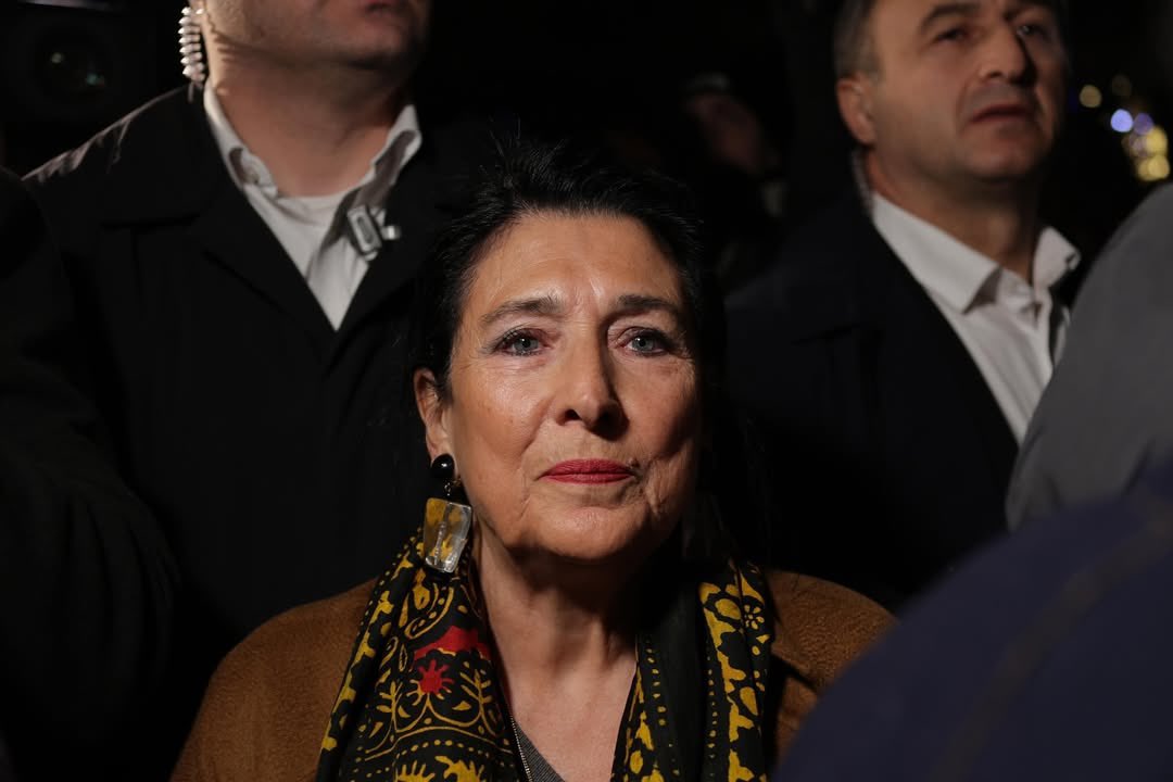 Mikiashvili_M's tweet photo. They threaten to jail her.
Does she look scared or confused to you?
She is so clearly rejoicing in history in making, fully comprehending her role in it, and feeling the ever-increasing public gratitude and love.
She’s the daughter of those exiled from the First Republic of Georgia by the Soviet Russia.
It’s her signature on the final document that expelled the Russian military bases from Georgia.
She said during the May 26 Independence Day speech that it’s no coincidence the country has such a President during these trying times.
She has also said that, unlike her ancestors, she won’t leave.
Just as the Georgian Dream regime proved to be the Trojan horse to the Georgian state, so did she prove to be the Trojan horse to the Georgian Dream and Bidzina Ivanishvili.
Born to be here and now.
Our only legitimate President.
@Zourabichvili_S! ✊🏻👑