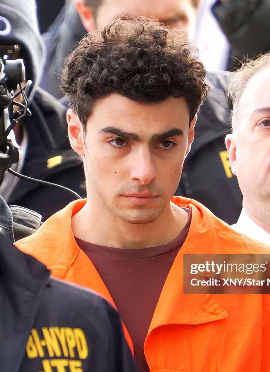 beauty marks on each cheek where angels kissed him