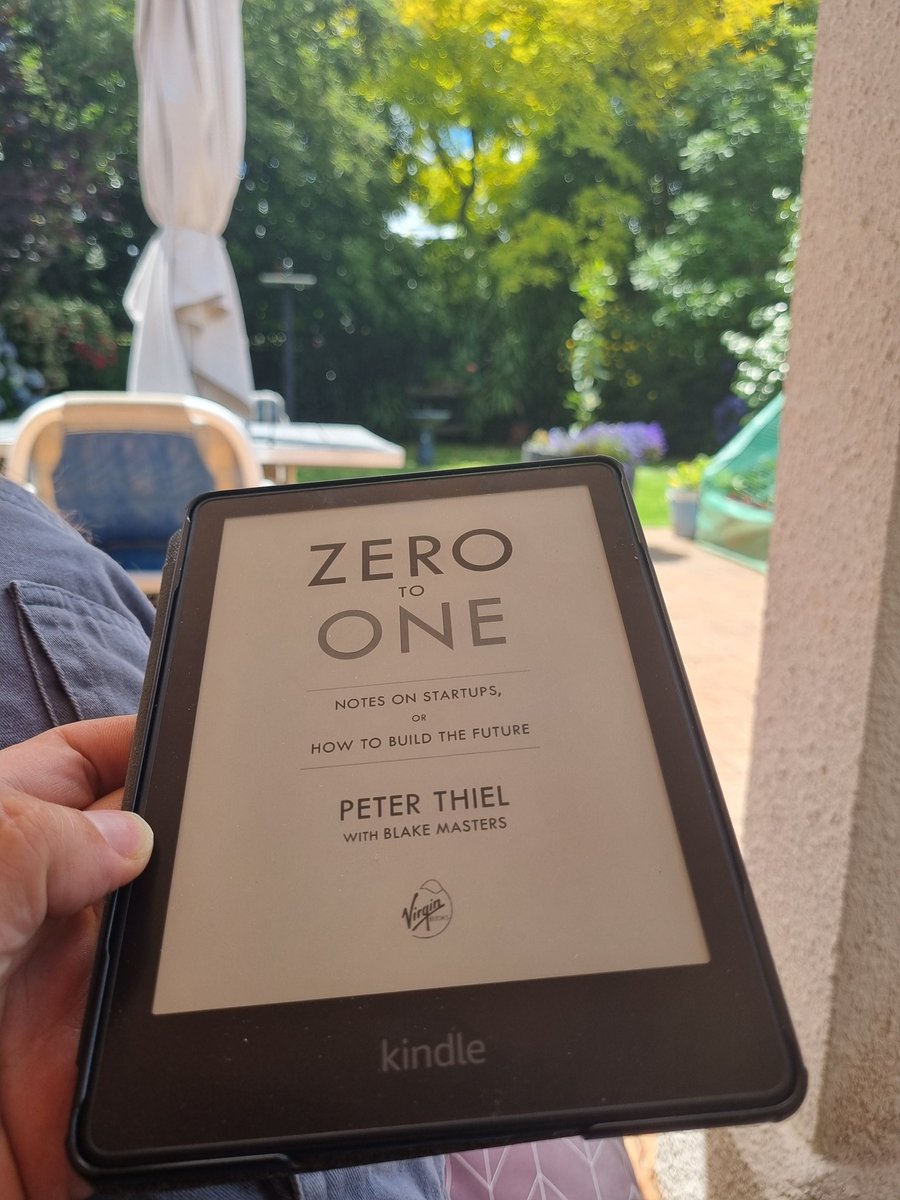 Nothing says 'summer vacation' like re-reading Zero to One with a cold drink in hand. My Christmas tradition. Living the nerd dream.