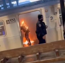 This photo of a police officer walking by doing nothing to safe the woman who was set on fire by a Third World Migrant is the perfect representation of what is wrong with New York City