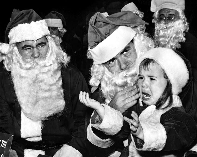 [1964] "I want mommie - Monique Charlan, 2, is a little overwhelmed when confronted by two Volunteers of America Sidewalk Santas, but she'll surely recover by Christmas morning." (Peter Banks - Valley Times Collection) buff.ly/3DoLNZT