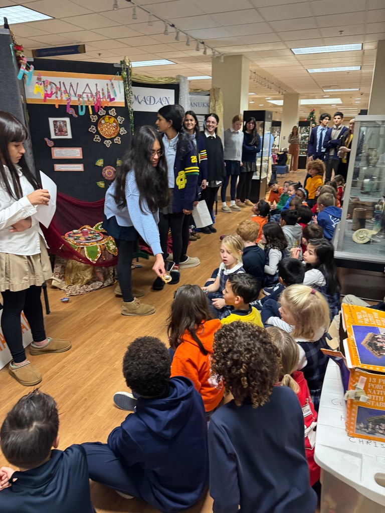 DCDSchool's tweet photo. The tradition continues as our second graders travel to the Upper School to learn about holidays our students celebrate. We are grateful our Upper School students do this each year, as it's wonderful to share our traditions and celebrations! #DCDSCommunity #HappyHolidays https://t.co/W6l8Mf8ZOa