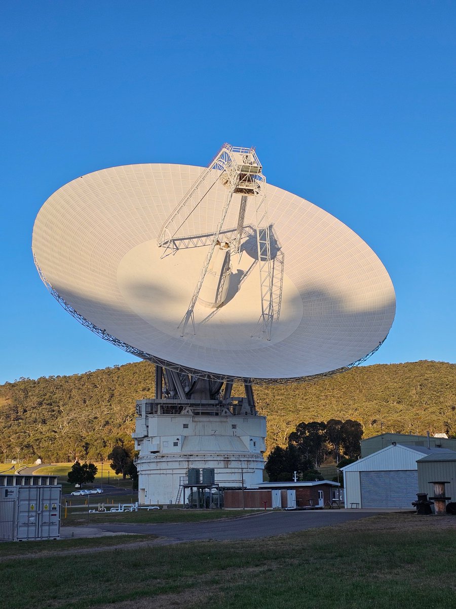 Sunset  in Canberra on Christmas Eve. DSS43 with the shadows of the hill ridgeline and a two of the trees growing on the top. Voyager 2 was being supported, Az 219 deg, El 39 deg, sunset 240 deg.