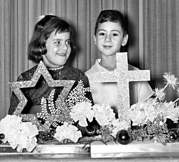 [1962] "Robert Selvin and Susan Ratliff stand behind the religious centerpieces--symbol of the Judeo-Christian faiths--used at a recent Christmas Hanukkah dinner sponsored by the Sunday School for Interfaith Families." (Valley Times Collection) buff.ly/3hPisxh