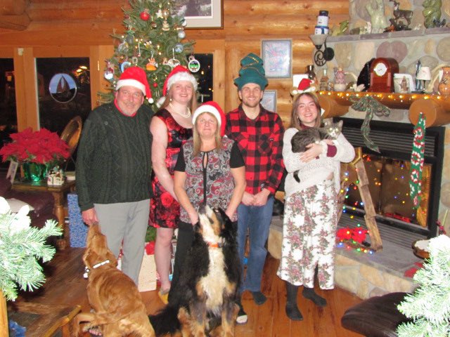 GeorgeJMitton's tweet photo. From our family, to yours. Wishing you all the best this Christmas and in the New Year. Bonus view, we tried to get one with the animals. https://t.co/laVhJRzJiK