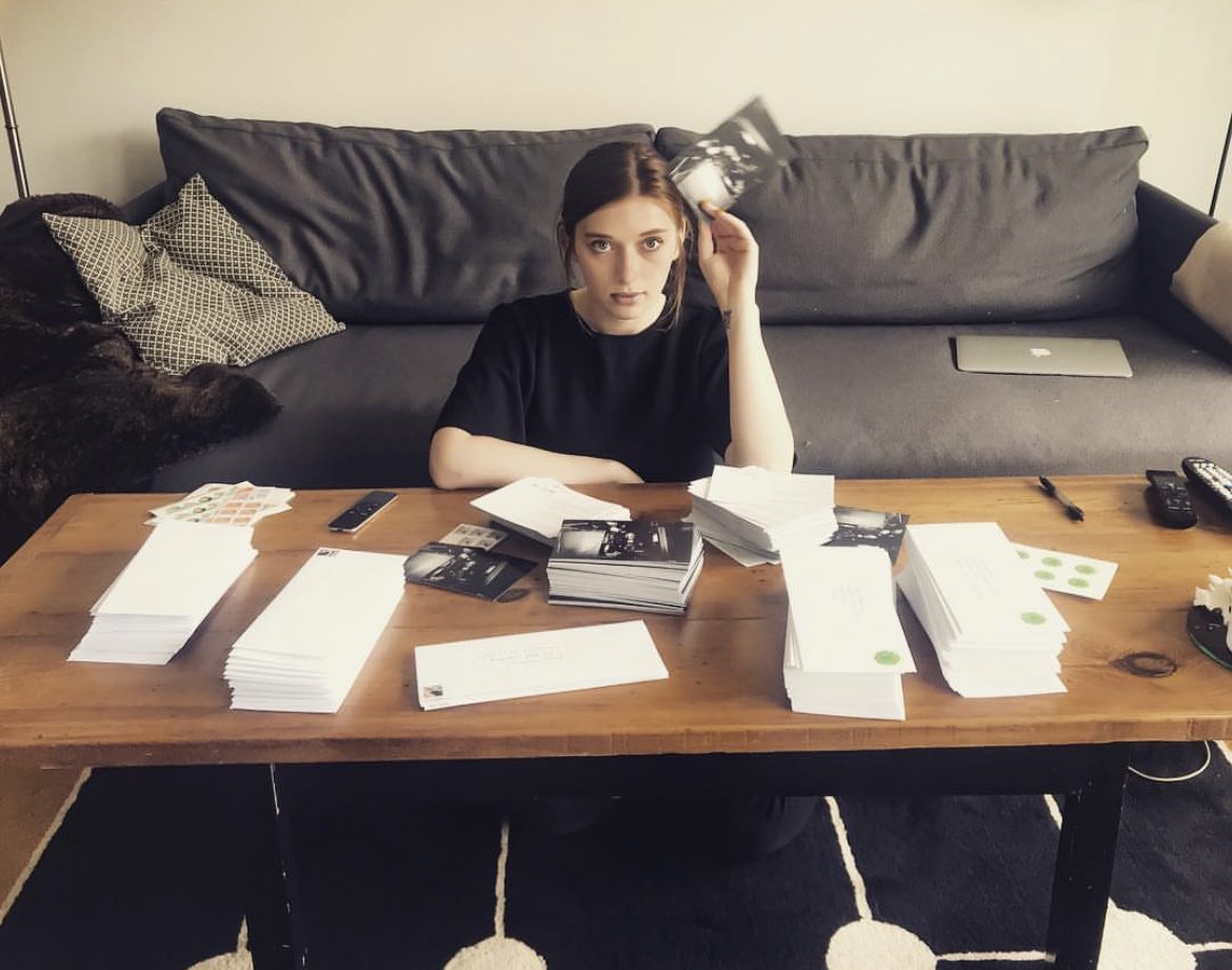 Verite's tweet photo. the internet is cool but have you ever just hand written thousands of postcards to fans of your work over the years for no other reason than to say hi and thank you.

my hand hurts. 
yes, that’s baby vérité https://t.co/of7MDKofxu