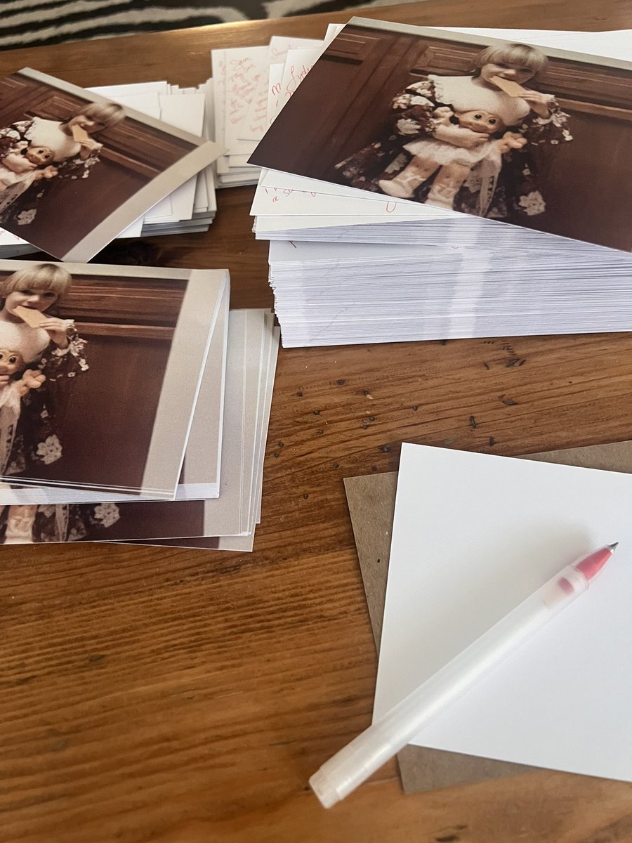 Verite's tweet photo. the internet is cool but have you ever just hand written thousands of postcards to fans of your work over the years for no other reason than to say hi and thank you.

my hand hurts. 
yes, that’s baby vérité https://t.co/of7MDKofxu